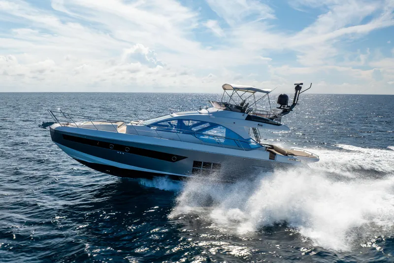 Slide: The Image of 2021 Azimut S6 Sportfly yacht cruising on open water, showcasing luxury and performance. - 51