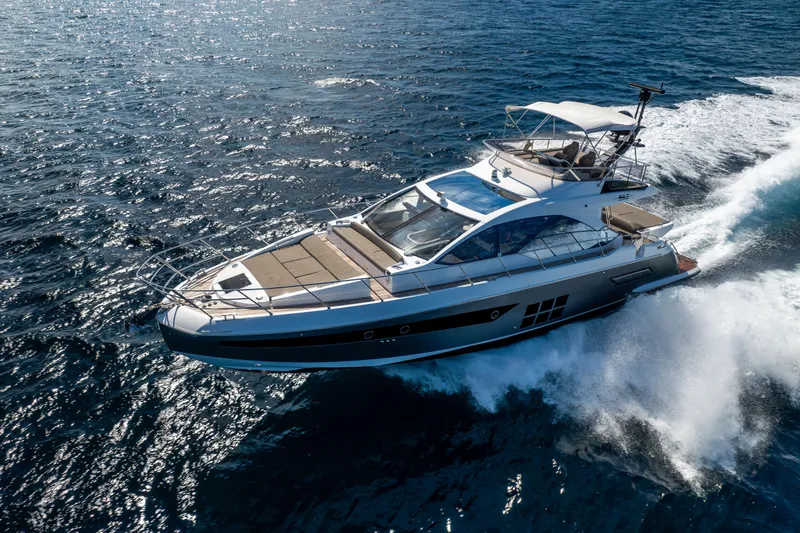 Slide: The Image of 2021 Azimut S6 Sportfly yacht cruising on open sea, showcasing luxury and performance. - 52