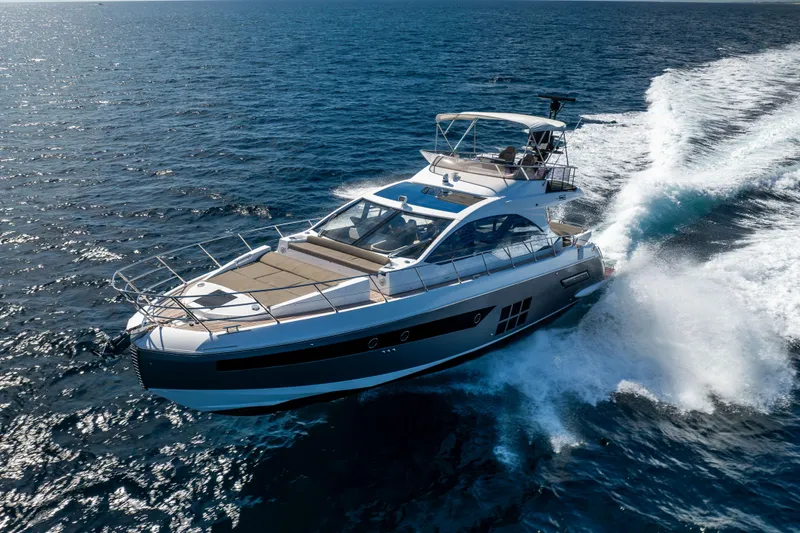 Slide: The Image of 2021 Azimut S6 Sportfly yacht cruising on open sea under clear skies. - 53