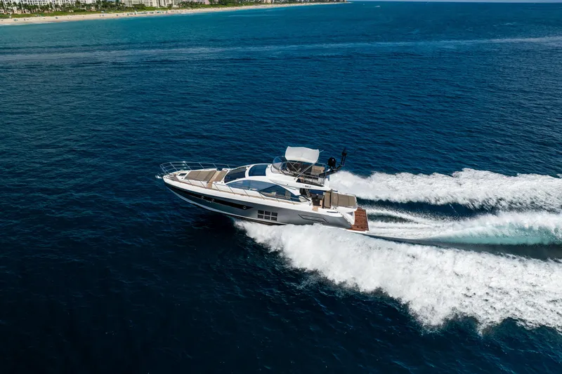 Slide: The Image of 2021 Azimut S6 Sportfly yacht cruising on open blue ocean waters. - 6