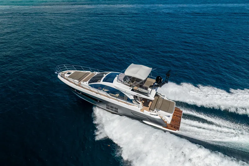 Slide: The Image of 2021 Azimut S6 Sportfly yacht cruising on open blue sea. - 7