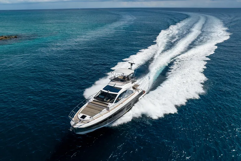 Slide: The Image of 2021 Azimut S6 Sportfly yacht cruising on open blue sea. - 8