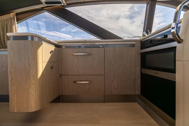 Slide: The Image of Luxurious interior of 2021 Azimut S6 Sportfly yacht with modern cabinetry and seating. - 95
