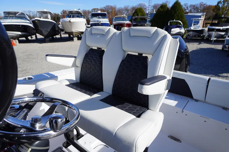 Slide: The Image of 2024 Tidewater 232 SS boat seats with sleek design and comfortable armrests. - 12