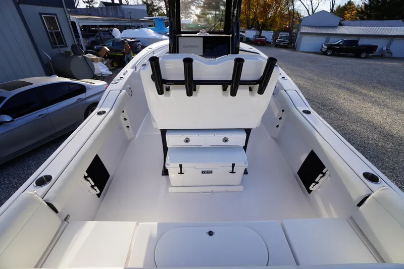 Slide: The Image of 2024 Tidewater 232 SS boat interior with seating and storage compartments. - 14