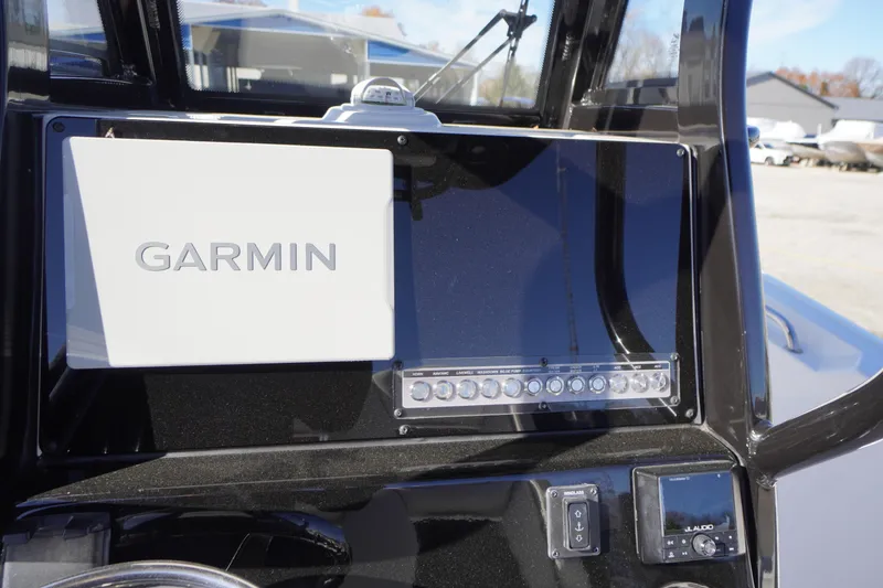 Slide: The Image of 2024 Tidewater 232 SS boat dashboard with Garmin navigation system. - 21