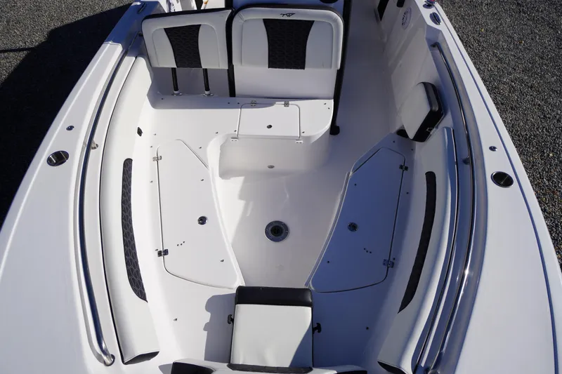 Slide: The Image of 2024 Tidewater 232 SS boat interior with seating and storage compartments. - 41