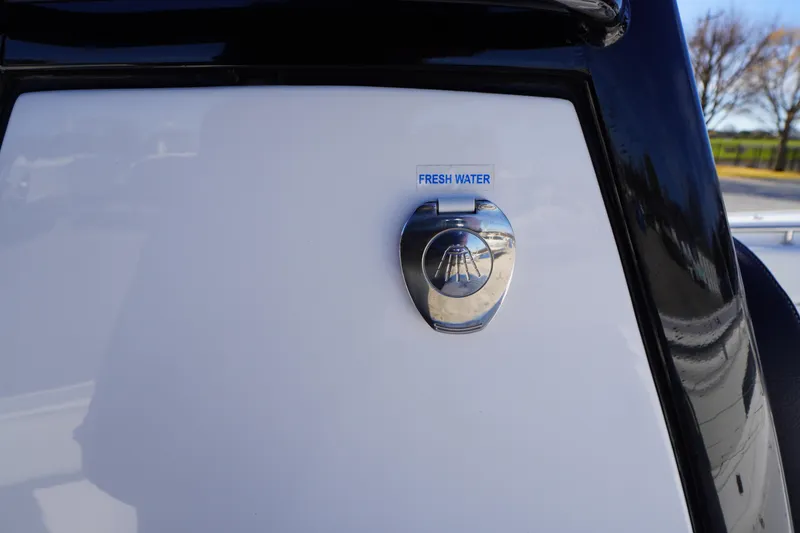 Slide: The Image of 2024 Tidewater 232 SS boat fresh water access point with chrome finish. - 43