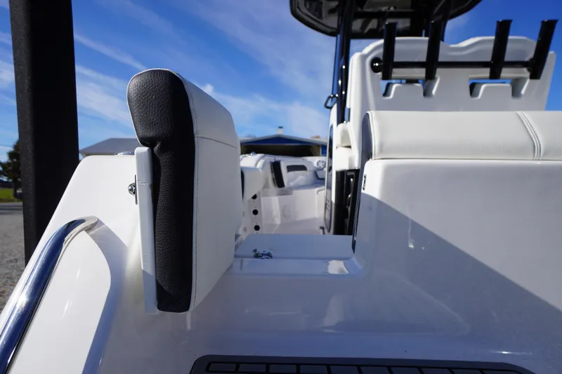 Slide: The Image of 2024 Tidewater 232 SS boat interior with sleek seating and rod holders. - 6