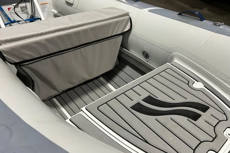 Slide: The Image of 2023 Highfield Classic 310 inflatable boat interior with cushioned seating and non-slip flooring. - 11