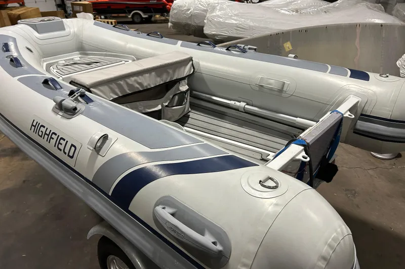 Slide: The Image of 2023 Highfield Classic 310 inflatable boat in a warehouse setting. - 6