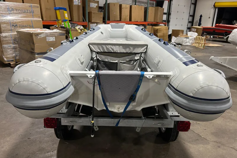 Slide: The Image of 2023 Highfield Classic 310 inflatable boat in warehouse, secured on trailer. - 8