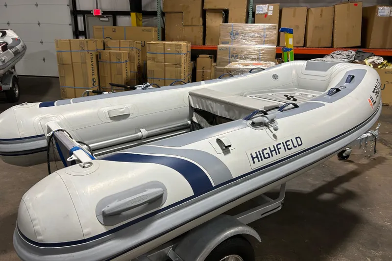 Slide: The Image of 2023 Highfield Classic 310 inflatable boat in warehouse setting. - 9