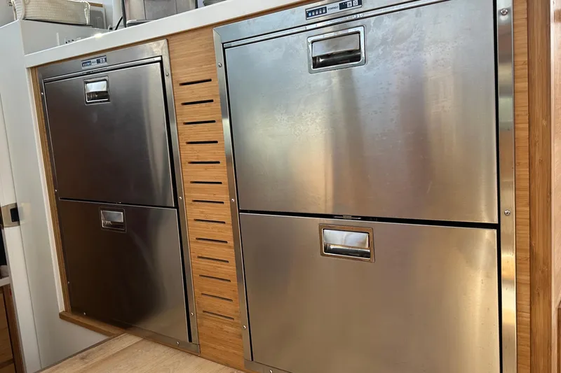 Slide: The Image of 2024 Balance 482 yacht with Yamaha motor and inflatable boat on water. - 10