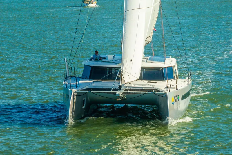 Slide: The Image of 2024 Balance 482 catamaran sailing on open water, front view. - 124