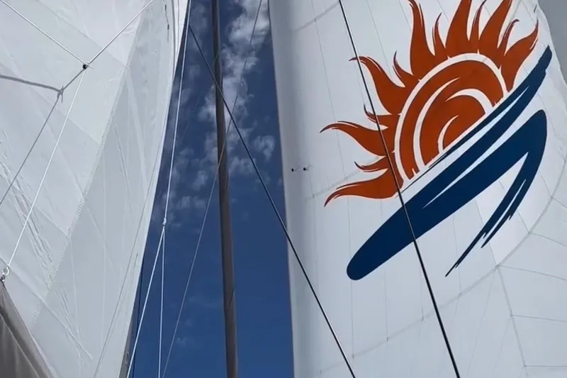 Slide: The Image of Sailboat with sun design on sail, Balance 482 model, 2023. - 133