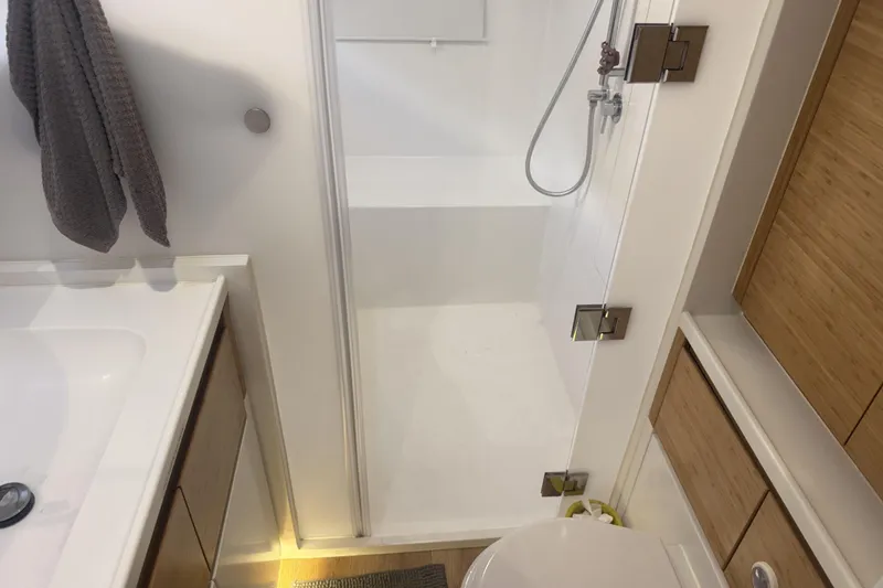 Slide: The Image of 2024 Balance 482 yacht sailing near a bridge on a sunny day. - 14