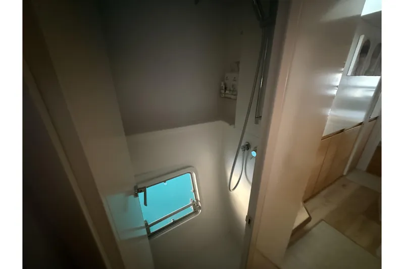 Slide: The Image of Colorful ropes and pulleys on a Balance 482 sailboat, 2024 model. - 16