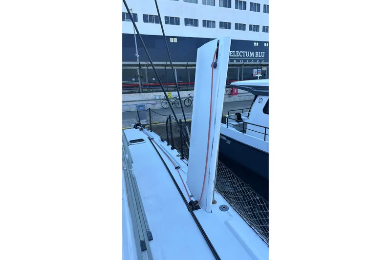 Slide: The Image of Close-up of Balance 482 sailboat rigging system, featuring pulleys and colorful ropes, 2024 model. - 24