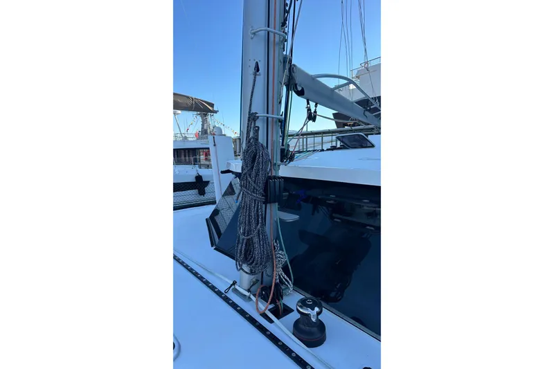 Slide: The Image of Close-up of a Balance 482 sailboat mast and sail, 2024 model, under clear blue sky. - 25