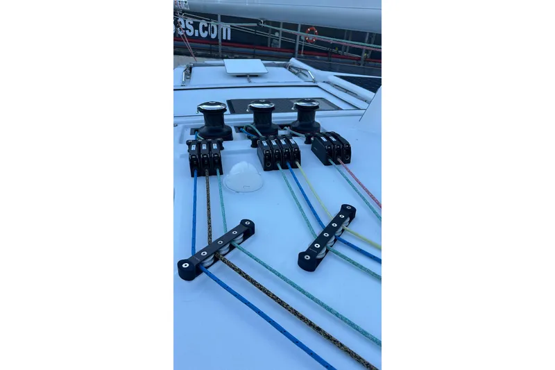 Slide: The Image of Sailboat mast and rigging on a 2024 Balance 482, with clear blue sky background. - 27