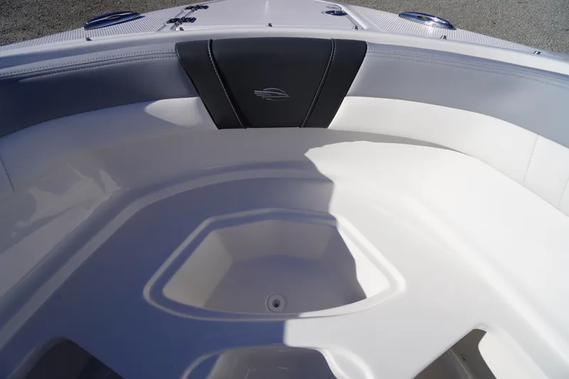 Slide: The Image of Interior view of 2026 Chaparral 23 SSi boat, featuring sleek white seating and modern design. - 12