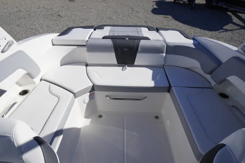 Slide: The Image of 2026 Chaparral 23 SSi boat interior with sleek white seating and modern design. - 33