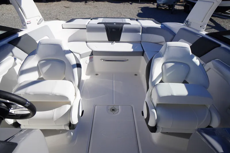 Slide: The Image of 2026 Chaparral 23 SSi boat interior with luxurious white seating and modern design. - 34