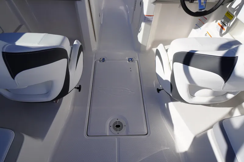 Slide: The Image of Interior of 2026 Chaparral 23 SSi boat with white and black seating. - 44