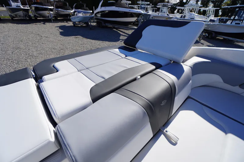 Slide: The Image of 2026 Chaparral 23 SSi boat interior with sleek, modern seating design. - 48