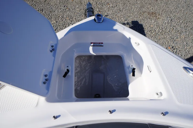 Slide: The Image of Open storage compartment on 2026 Chaparral 23 SSi boat, showing interior details. - 5
