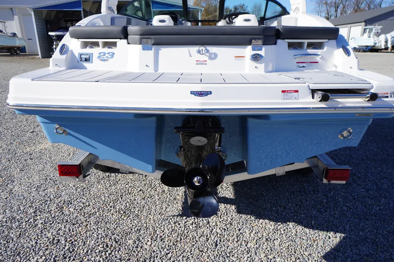 Slide: The Image of Rear view of 2026 Chaparral 23 SSi boat on trailer, showcasing propeller and swim platform. - 60