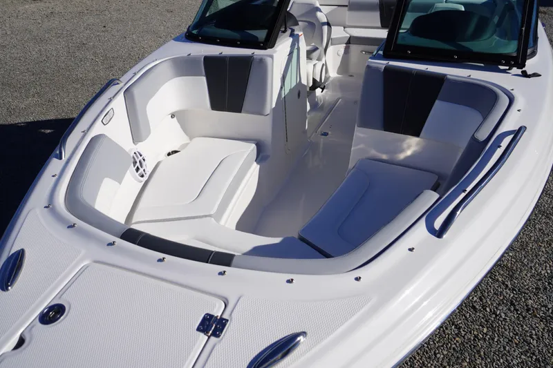 Slide: The Image of 2026 Chaparral 23 SSi boat interior with white seating and sleek design. - 14