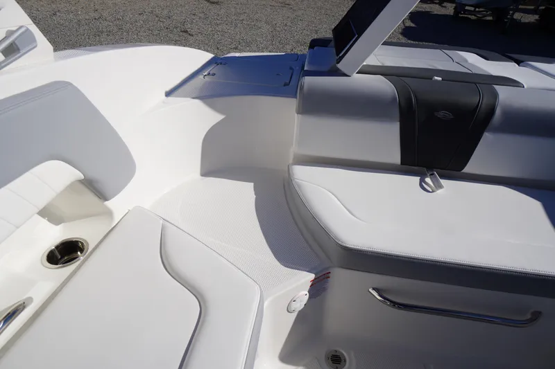 Slide: The Image of Interior seating of 2026 Chaparral 23 SSi boat, featuring sleek white upholstery. - 39