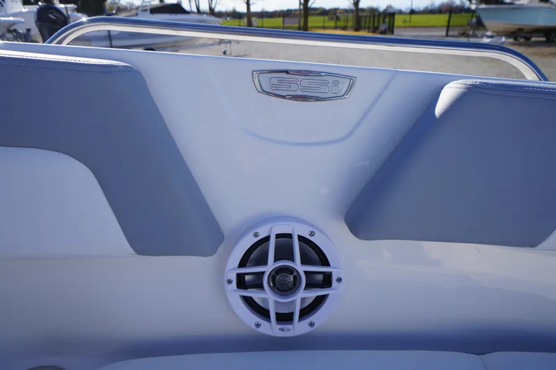 Slide: The Image of 2026 Chaparral 23 SSi boat interior with speaker and SSI logo. - 8