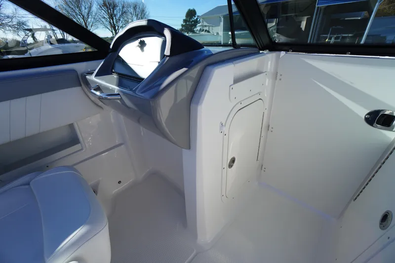 Slide: The Image of Interior of 2026 Chaparral 23 SSi boat, featuring sleek design and modern controls. - 23