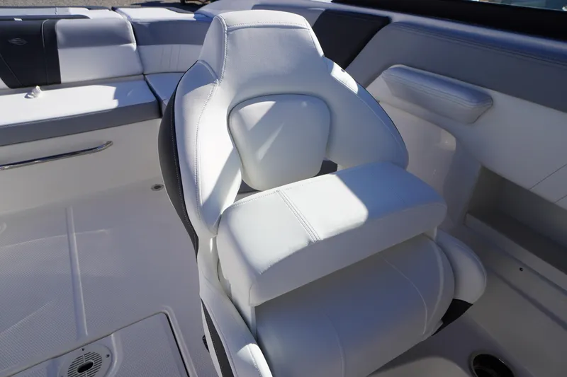 Slide: The Image of 2026 Chaparral 23 SSi boat interior with white seating and modern design. - 35