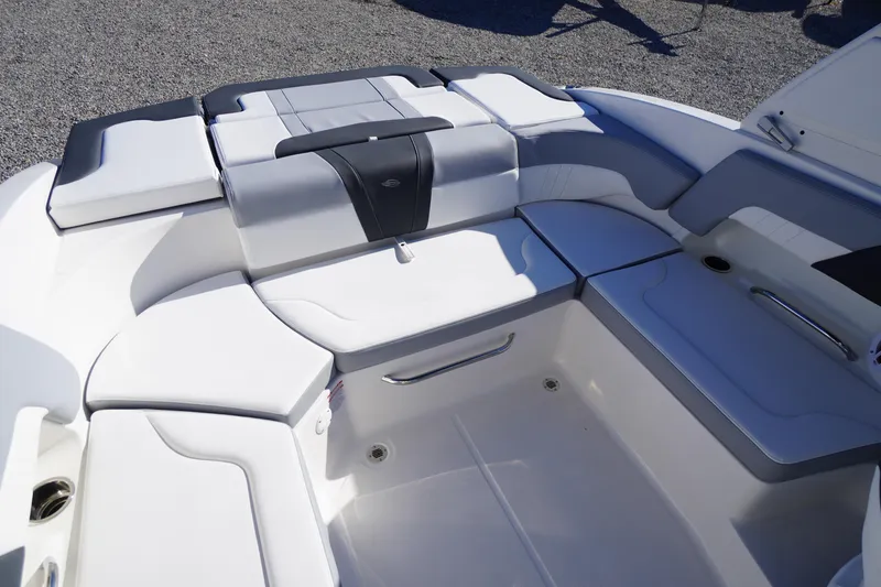 Slide: The Image of 2026 Chaparral 23 SSi boat interior with sleek white seating and modern design. - 50