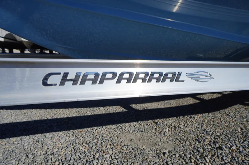Slide: The Image of 2026 Chaparral 23 SSi boat logo on metallic surface, close-up view. - 65