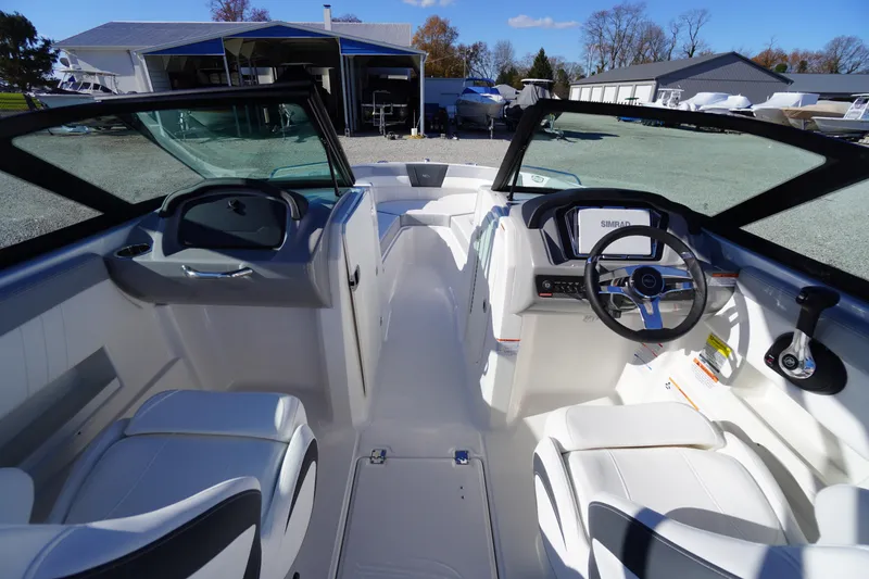Slide: The Image of Interior view of 2026 Chaparral 23 SSi boat with modern dashboard and seating. - 16