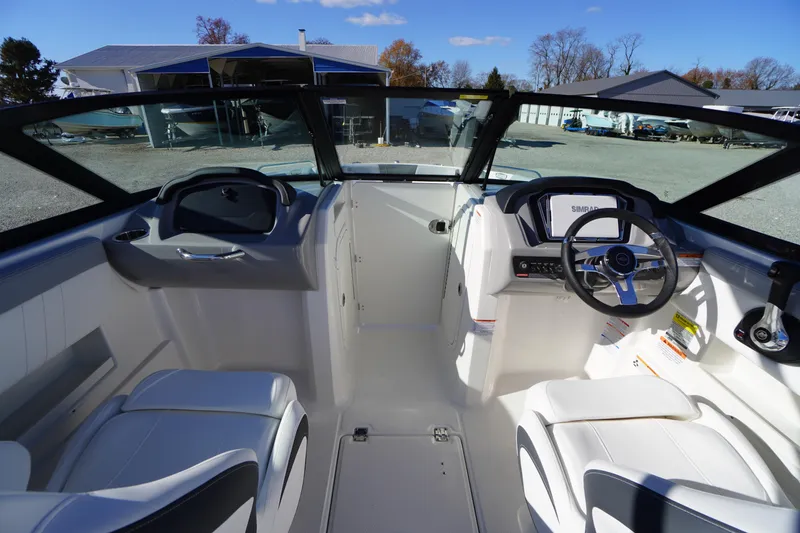Slide: The Image of 2026 Chaparral 23 SSi boat interior with modern dashboard and seating. - 26