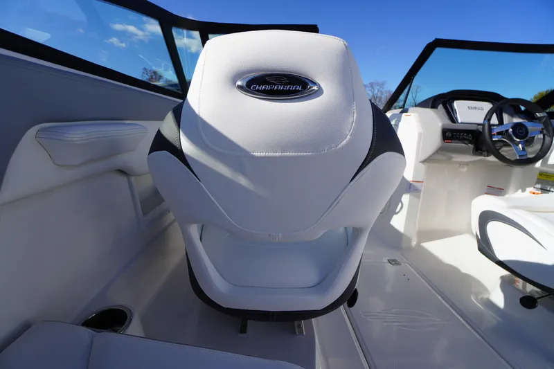 Slide: The Image of 2026 Chaparral 23 SSi boat interior with white seating and steering wheel. - 30