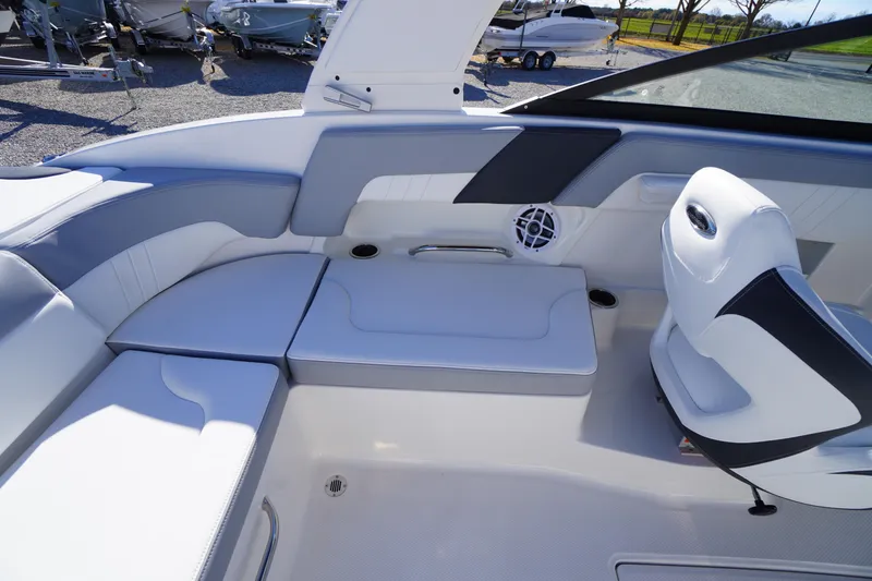 Slide: The Image of 2026 Chaparral 23 SSi boat interior with white seating and cup holders. - 38