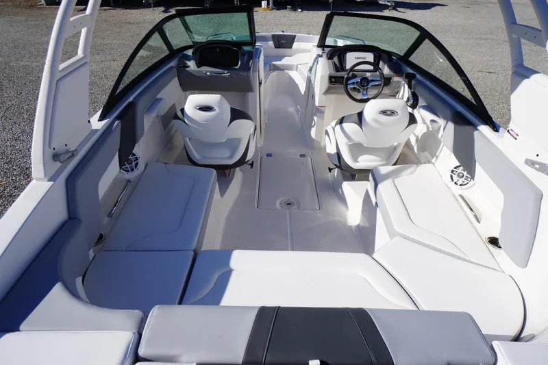Slide: The Image of 2026 Chaparral 23 SSi boat interior with modern seating and steering console. - 49