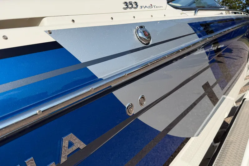 Slide: The Image of 2019 Formula 353 FASTech boat with dual propellers and outboard motors on a trailer. - 18