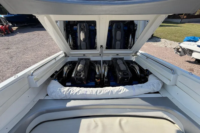 Slide: The Image of 2019 Formula 353 FASTech boat on a triple-axle trailer, parked outdoors. - 20