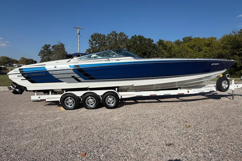 Slide: The Image of 2019 Formula 353 FASTech boat engine compartment with dual engines, open hatch view. - 25