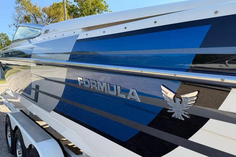 Slide: The Image of 2019 Formula 353 FASTech boat interior with white and blue seating, sleek design. - 35