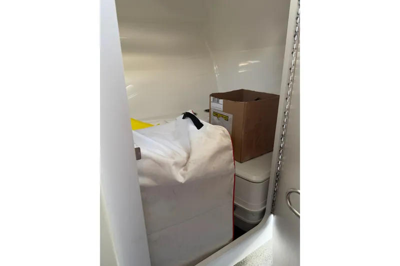 Slide: The Image of Storage compartment in 2019 Formula 353 FASTech boat with boxes and bags. - 66