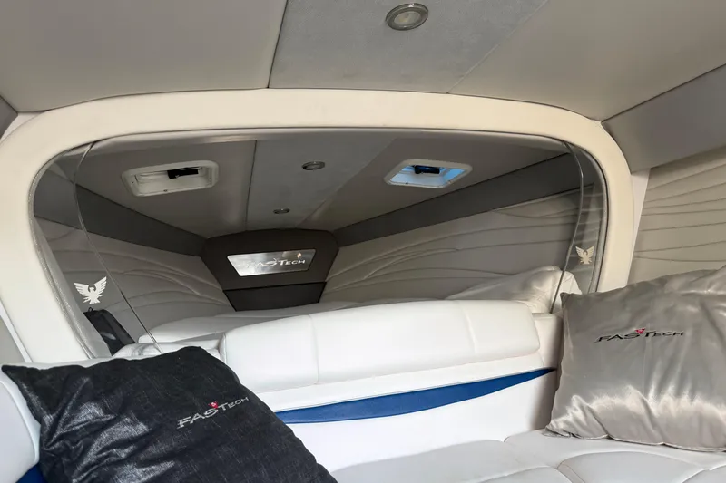 Slide: The Image of 2019 Formula 353 FASTech cabin interior with plush seating and branded pillows. - 68